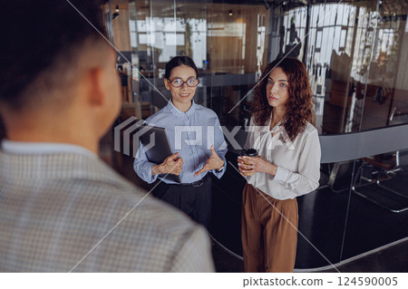 Participate in a dynamic business meeting in a modern office with high energy and collaboration 124590005