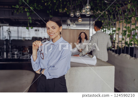 A Professional Woman Engaged in a Contemporary Office Environment, Embracing Modern Design 124590210