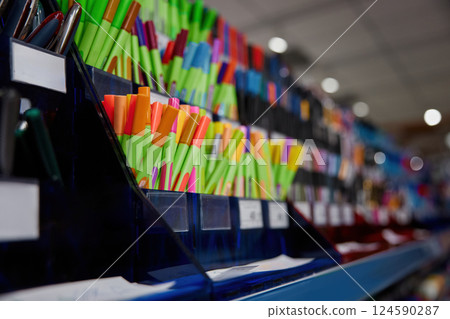 Pens display with various colors and designs in stationery store 124590287