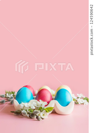 Colorful eggs with spring flowers in porcelain box. Easter. Spring. Close up. Colorful eggs with spring flowers in porcelain box. Easter. Spring. Close up. 124590642