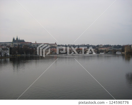 Prague Castle and Charles Bridge in winter as seen from the Vltava River 124590776