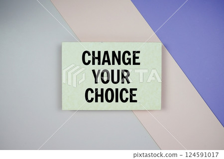 Change Your Choice text on paper card on purple and pink geometric background Change Your Choice text on paper card on purple and pink geometric background 124591017