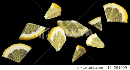 Falling lemon slices on black background, collection of citrus cuts Falling lemon slices on black background, collection of citrus cuts 124591099