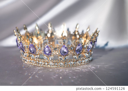 Royal golden crown with amethyst gemstones and diamonds 124591126