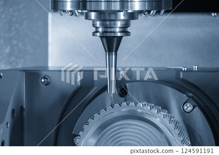 The 5-axis CNC milling machine cutting the gear part with solid ball nose end mill tool in the light blue scene. 124591191