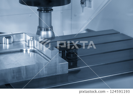 The CNC milling machine rough cutting the aluminum parts by face mill tools in the light blue scene. 124591193