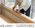 Carpenter doing interior construction work 124591862