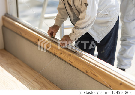 Carpenter doing interior construction work 124591862