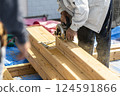 Carpenter doing interior construction work 124591866
