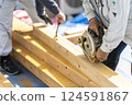 Carpenter doing interior construction work 124591867