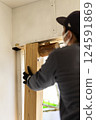 Carpenter doing interior construction work 124591869