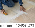 Carpenter doing interior construction work 124591873