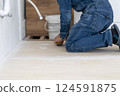 Carpenter doing interior construction work 124591875