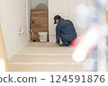 Carpenter doing interior construction work 124591876