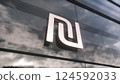 Israel Shekel currency sign on a modern glass skyscraper. Business and finance concept. 3d illustration 124592033