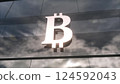 Bitcoin currency sign on a modern glass skyscraper. 3d illustration 124592043