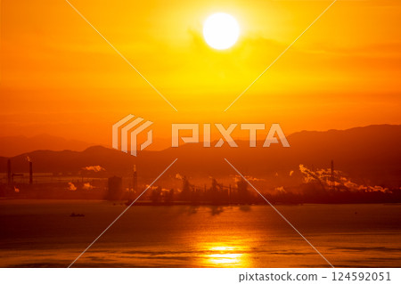 Sunrise over Beppu Bay and a view of the Oita coastal industrial complex and the Saganoseki Peninsula Sunrise over Beppu Bay and a view of the Oita coastal industrial complex and the Saganoseki Peninsula 124592051