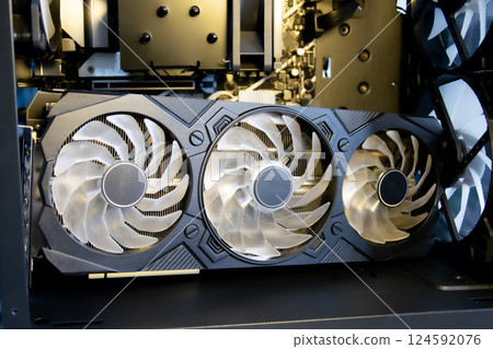 A modern and powerful video card or graphics card in a computer. A modern and powerful video card or graphics card in a computer. 124592076