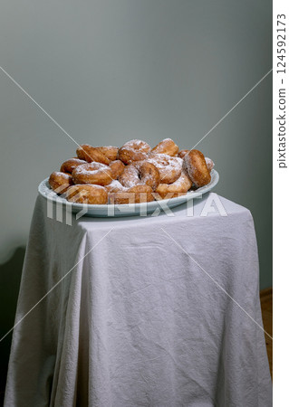 Sugar Powdered Donuts on White Plate Sugar Powdered Donuts on White Plate 124592173