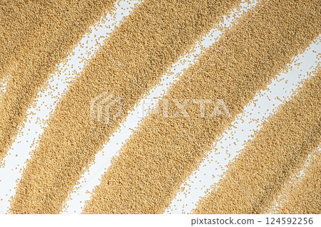 Raw organic amaranth grains on a white background, top view 124592256