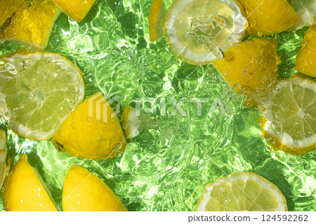 Juicy lemons moving underwater close-up top view 124592262