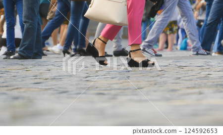Legs of tourists on Red Square in Moscow 124592653