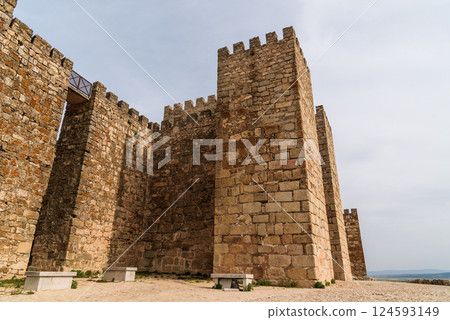 The imposing medieval castle of Trujillo in Extremadura, Spain, rises majestically against the sky. 124593149