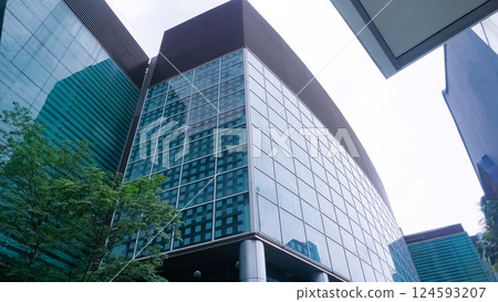 View of modern business skyscrapers glass and sky view landscape of commercial building in central city View of modern business skyscrapers glass and sky view landscape of commercial building in central city 124593207