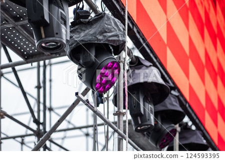 stage lighting setup and led screen installation for live event, concert lights rigs and digital screen calibration for event production stage lighting setup and led screen installation for live event, concert lights rigs and digital screen calibration for event production 124593395