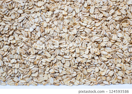 Oatmeal background, fresh oat flakes as texture Oatmeal background, fresh oat flakes as texture 124593586
