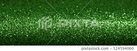 Vibrant green glitter texture with soft sparkling highlights Vibrant green glitter texture with soft sparkling highlights 124594060