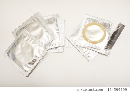 An open condom in a package. Male contraceptives. An open condom in a package. Male contraceptives. 124594599