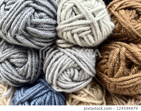 Colorful Wool Yarn Skeins Arranged in a Neat Pile Colorful Wool Yarn Skeins Arranged in a Neat Pile 124594979