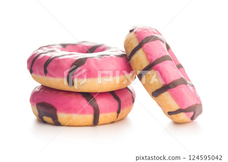 Sweet pink donut with chocolate strips isolated on white background. 124595042