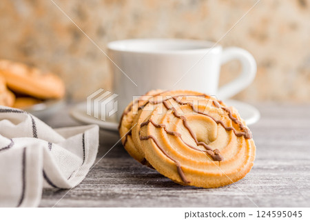 Sweet chocolate cookies on kitchen table. 124595045