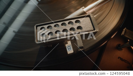 Vinyl Record Spinning. Needle Gently Scratching Grooves, Playing Music on Vinyl Record Player 124595048