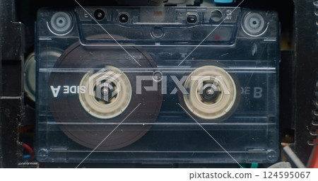 Retro Audio Cassette Tape Playing 90s Mixtapes Sound, Reels Spinning 124595067