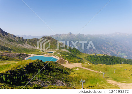 Scenic alpine landscape Kals Grossglockner valley with blue artificial lake Tyrol mountains nature background. Panoramic view Alps summer hiking trail adventure tourism recreational area 124595272