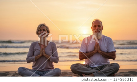 A elderly couple practicing meditation near the ocean 124595315