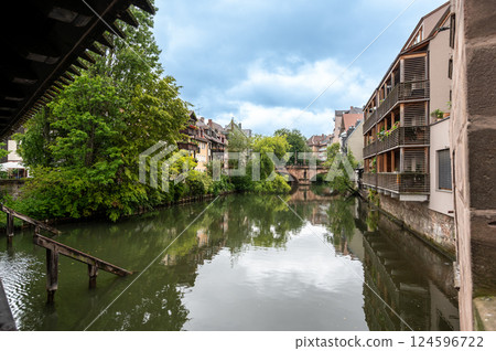 Nuremberg,Germany, August 1, 2023. A charming riverside view in the old town. Historic houses overlook the water. Travel destinations. Nuremberg,Germany, August 1, 2023. A charming riverside view in the old town. Historic houses overlook the water. Travel destinations. 124596722