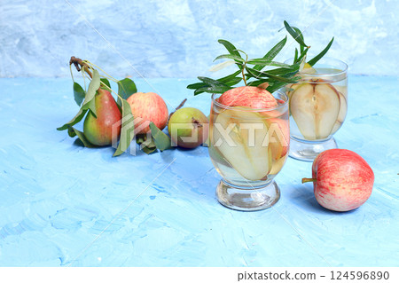 Apple and pear cider, juice or fruit drink and ingredients on a sunny table. The concept of diet and weight loss. Apples help cleanse the body and reduce weight. Healthy eating, body detoxification Apple and pear cider, juice or fruit drink and ingredients on a sunny table. The concept of diet and weight loss. Apples help cleanse the body and reduce weight. Healthy eating, body detoxification 124596890
