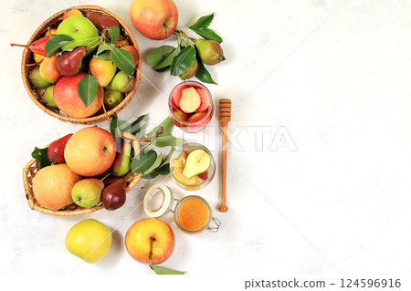 Apple-pear cider with honey, juice. Diet and weight loss concept, jewish new year Rosh Hashanah background. Apples help cleanse the body and reduce weight. Healthy eating, body detoxification Apple-pear cider with honey, juice. Diet and weight loss concept, jewish new year Rosh Hashanah background. Apples help cleanse the body and reduce weight. Healthy eating, body detoxification 124596916