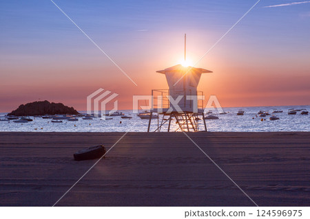 Lifeguard tower at sunrise in Tossa de Mar, Spain 124596975