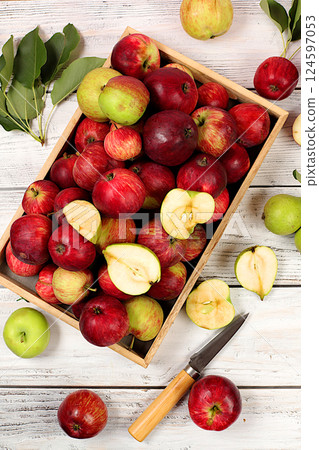 Autumn composition of apples in box on sunny wooden table, thanksgiving background, harvest, healthy natural food concept, detox diet and body cleansing, banner on screen, cafe, restaurant, selective Autumn composition of apples in box on sunny wooden table, thanksgiving background, harvest, healthy natural food concept, detox diet and body cleansing, banner on screen, cafe, restaurant, selective 124597053