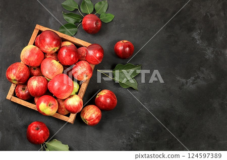 Apples in a basket on a concrete table, thanksgiving background, harvest, healthy natural food concept, detox diet and body cleansing, screen banner, cafe, restaurant, selective focus Apples in a basket on a concrete table, thanksgiving background, harvest, healthy natural food concept, detox diet and body cleansing, screen banner, cafe, restaurant, selective focus 124597389