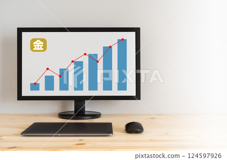A screen showing gold letters and an upward trending graph 124597926