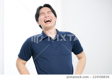 A man wearing a polo shirt - Image of a caregiver, delivery worker, blue-collar worker, etc. 124598656