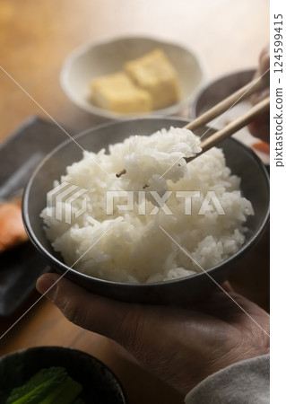 Pick up your breakfast dish with chopsticks Pick up your breakfast dish with chopsticks 124599415