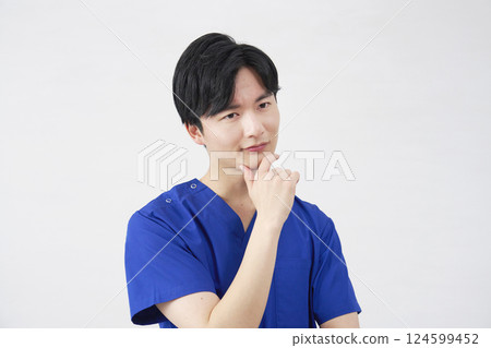 Doctor, nurse, dentist, caregiver, male, thinking, white background Doctor, nurse, dentist, caregiver, male, thinking, white background 124599452
