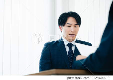 Businessman getting nervous during an interview 124600202